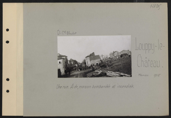 Louppy-le-Château. Une rue. À droite, maison bombardée et incendiée
