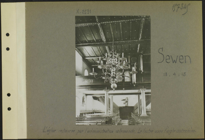 Sewen. L'église restaurée par l'administration allemande. Le lustre avec l'aigle autrichien
