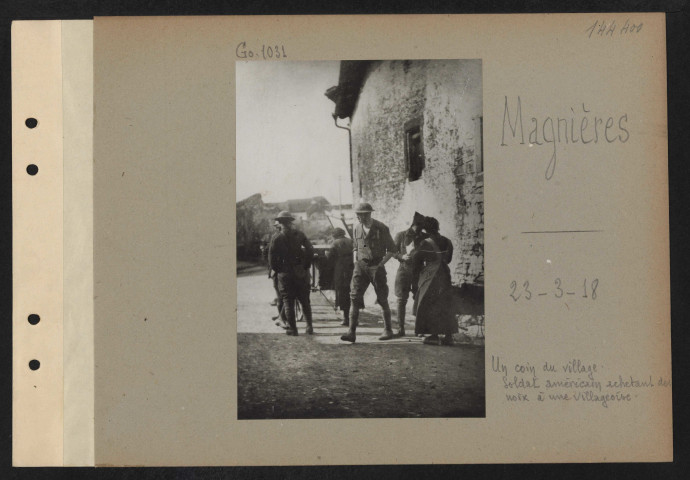 Magnières. Un coin du village. Soldat américain achetant des noix à une villageoise